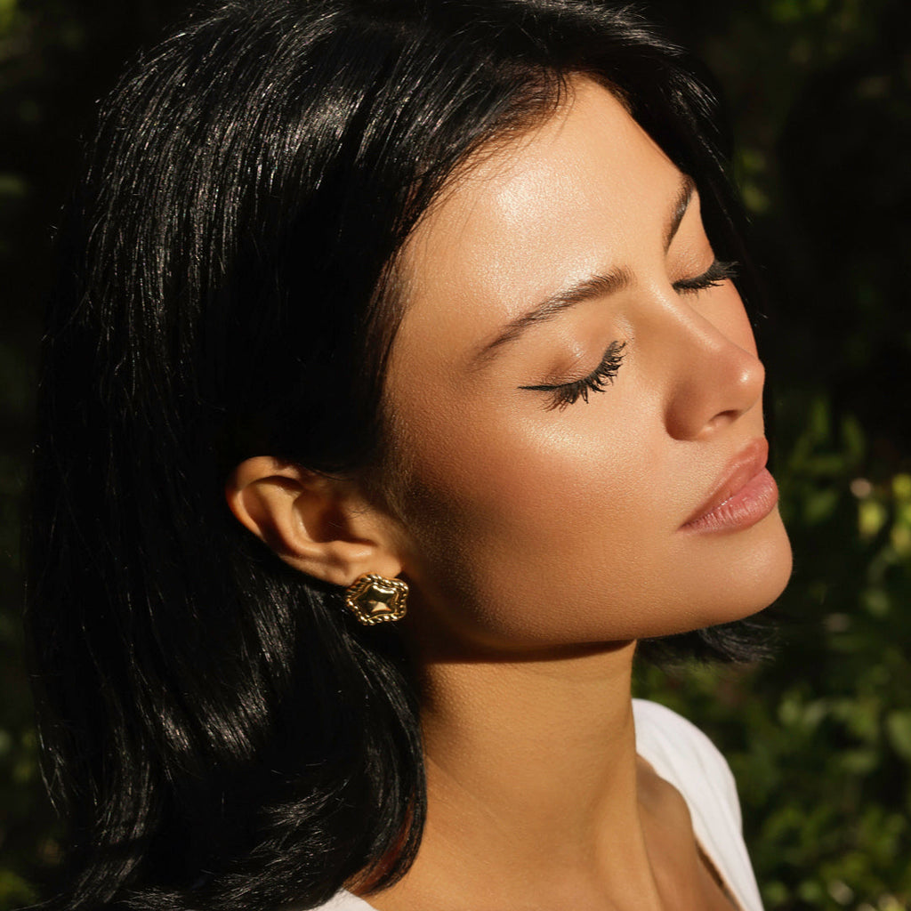 LA FORZA Daisy Earrings worn by model with dark hair editorial shot