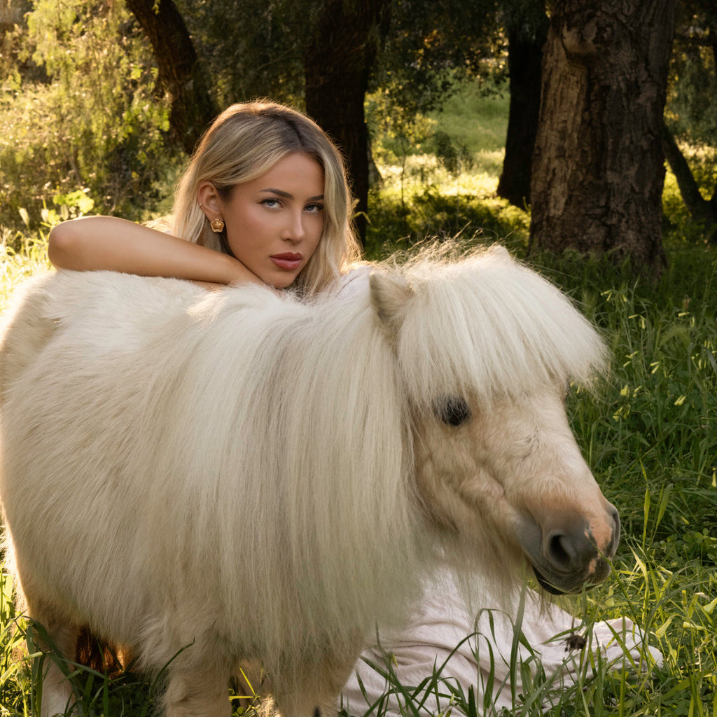 LA FORZA Daisy Earrings styled on model outdoors equestrian editorial