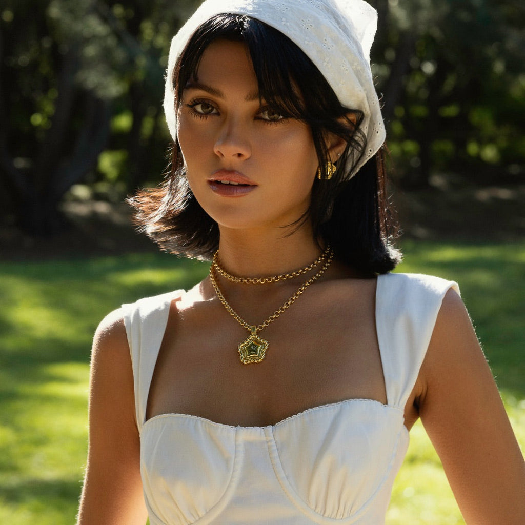 Close-up of LA FORZA Daisy Multi-Wear Necklace gold chain and sculptural pendant detail